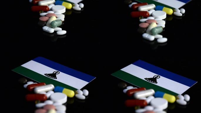 莱索托国旗，黑色背景上有许多医用药丸