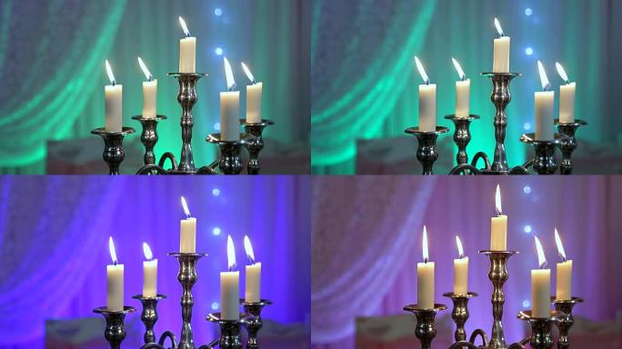 宴会桌上烛台上的蜡烛。五支蜡烛