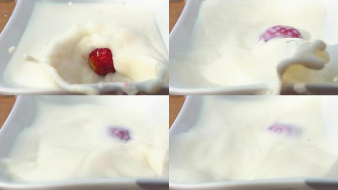 草莓掉在装有奶油的碗里