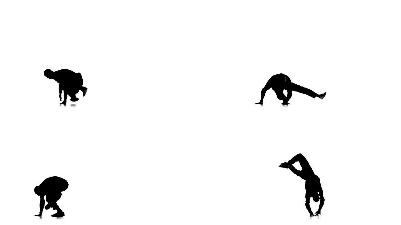 男子跳霹雳舞专业动作和转弯，白色，剪影，慢动作
