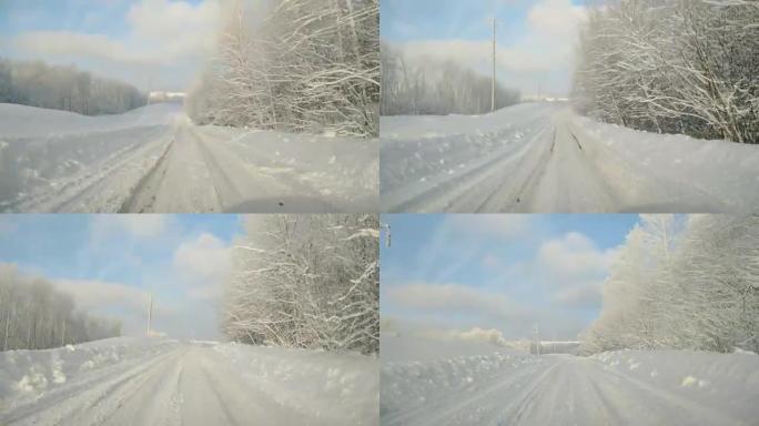 在雪乡路上驾驶POV。冬季雪山公路行驶。森林