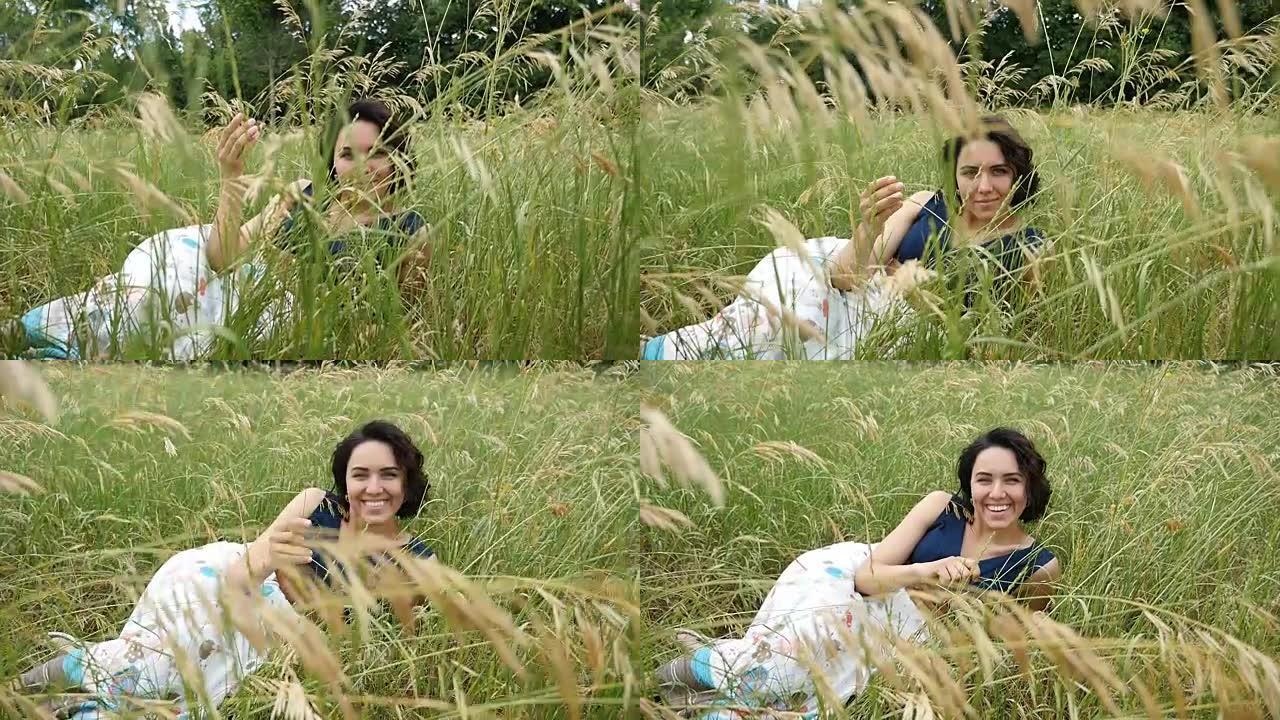一个年轻浪漫的女人躺在风景如画的草坪上，就像slo-mo的大猎豹一样