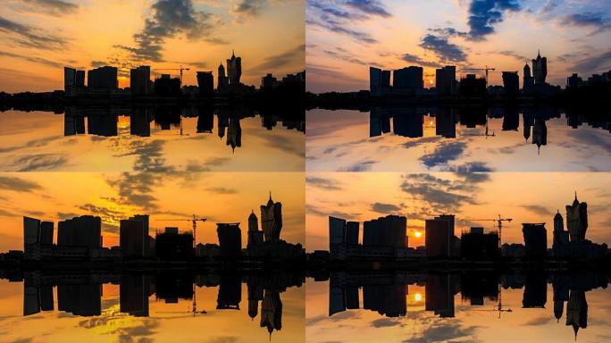 日落和反射4k延时拍摄的澳门城市建筑剪影 (2张照片)