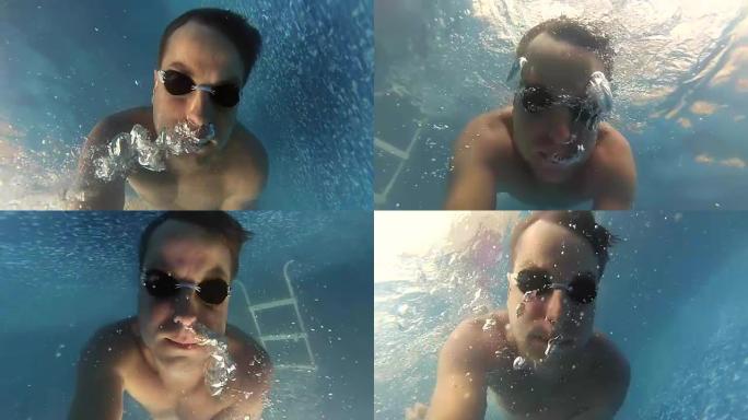 男子在水下游泳呼吸空气慢动作