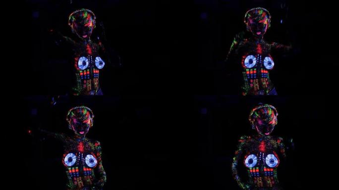 赤裸上身的女人涂了紫外线粉作为DJ控制台舞蹈