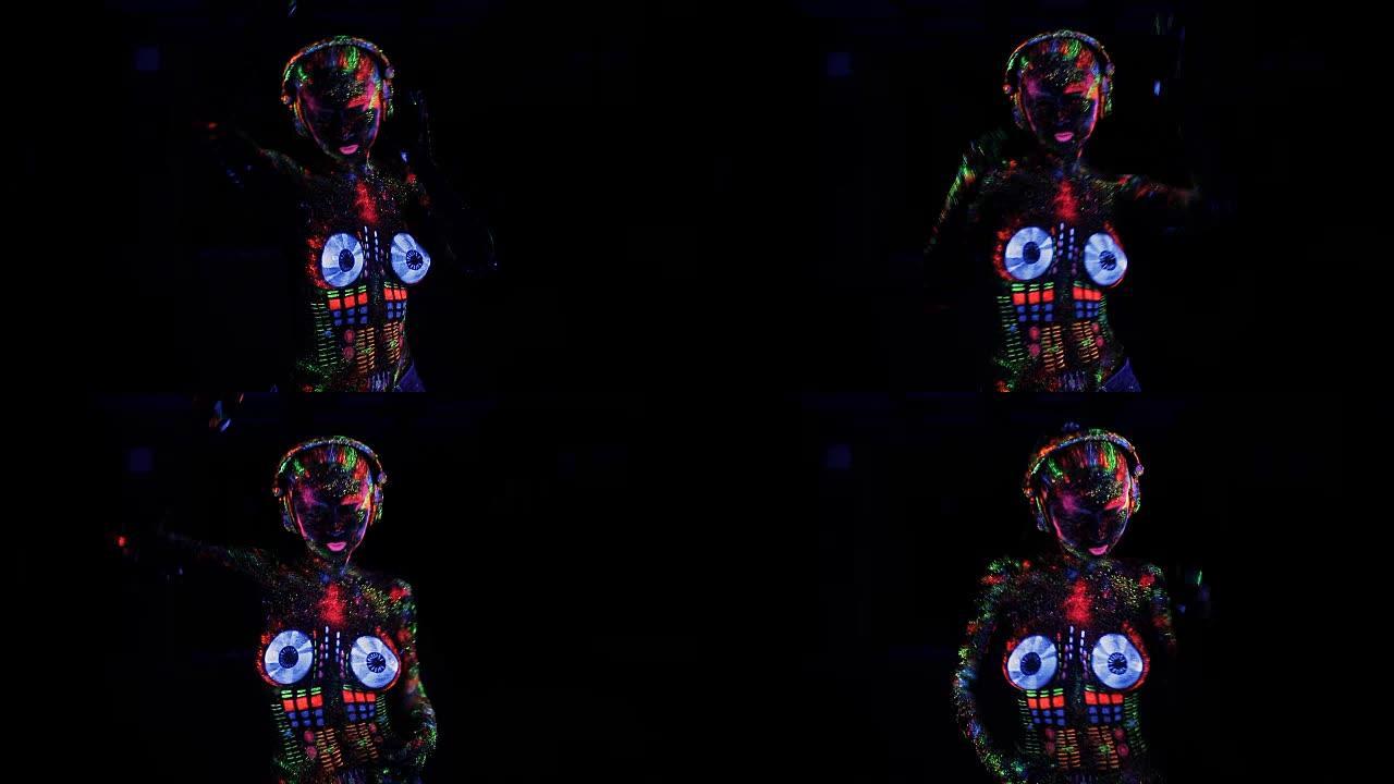 赤裸上身的女人涂了紫外线粉作为DJ控制台舞蹈