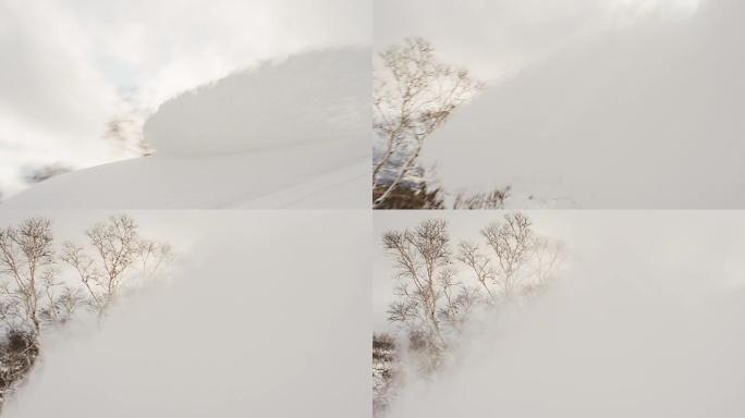 滑雪板斜线将雪喷向相机日落剪影