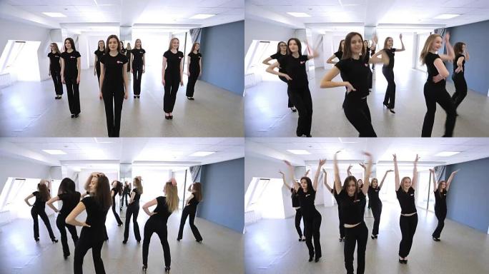 在模型学校中，女性正在重复舞蹈动作