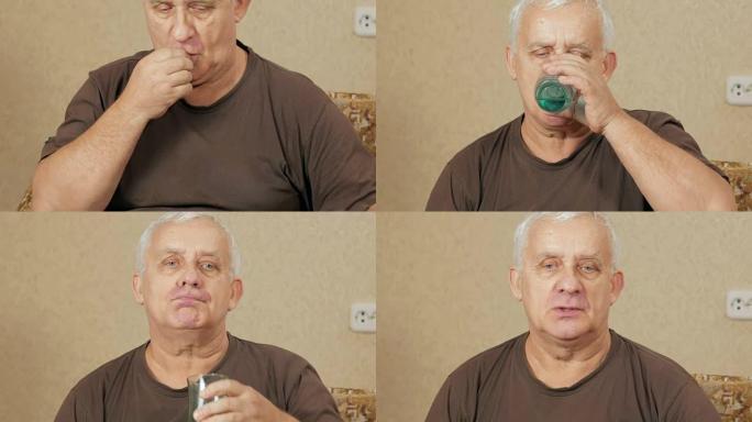 生病的超重老人在沙发上的房子里吃药，在杯子里喝水。他制造了几种光滑的液体。老年人的健康观念