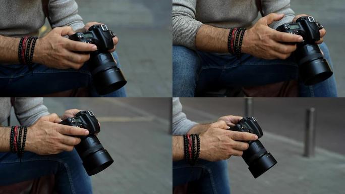 男性手的特写镜头看着照相机