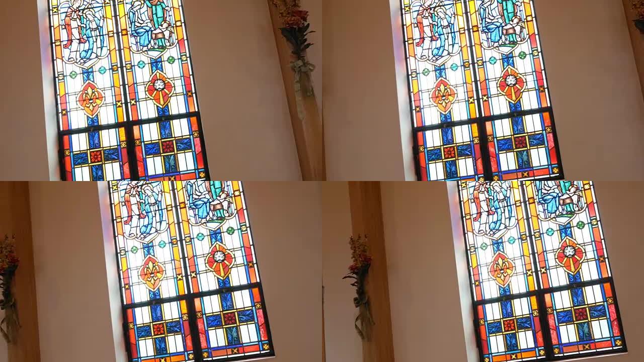 相机在教堂的彩色玻璃窗上平移