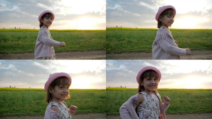 在背光肖像中奔跑的女孩子，微笑的女孩，沿着田野路奔跑，快乐的孩子在城市外玩耍，健康的童年