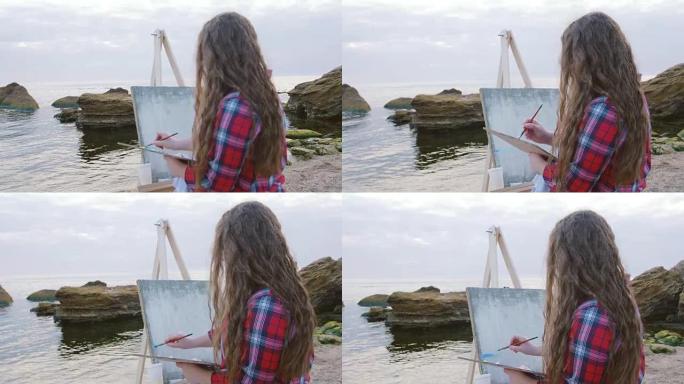 女艺术家绘画海洋景观