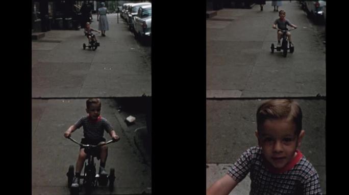 小男孩骑三轮车沿着纽约街1957