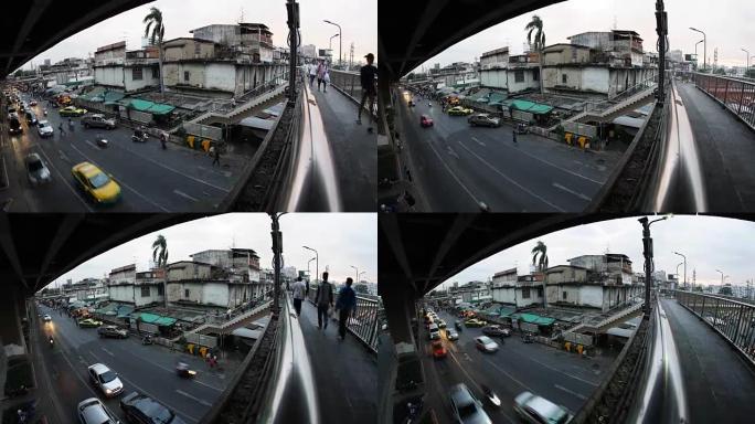 2016年12月31日: 时间流逝-在泰国曼谷的天桥上行走的身份不明的人以及街道上的交通瞬间，由鱼眼