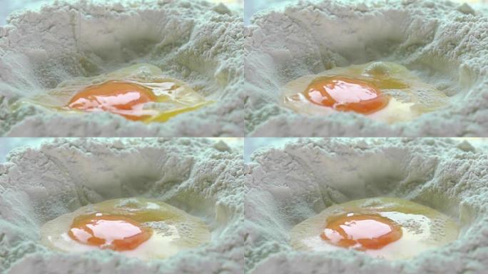 鸡蛋落入面粉微距超慢动作镜头