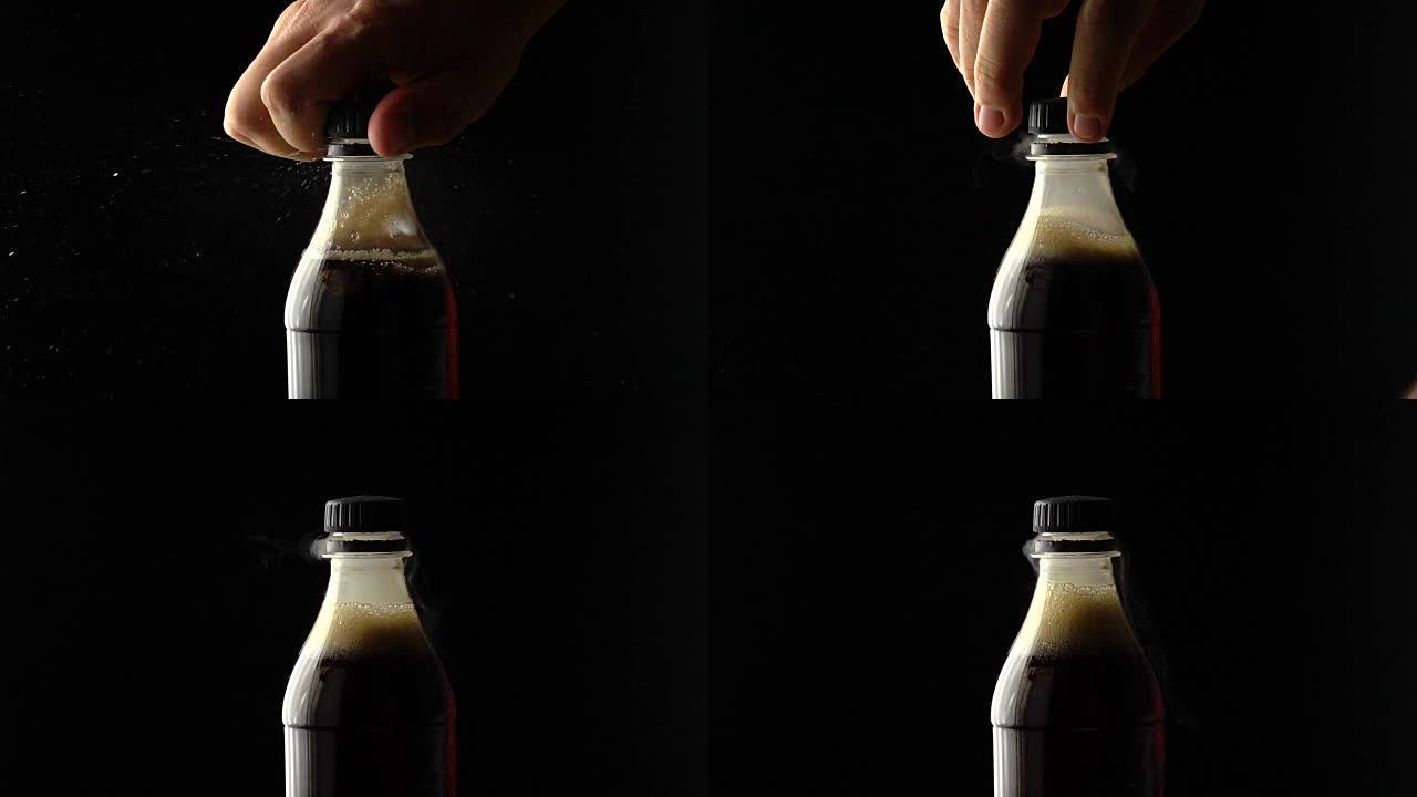 男人用螺丝顶打开可乐塑料瓶。慢动作镜头，黑色背景