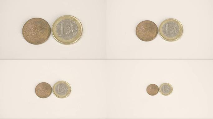 一枚镀金的Austia硬币和1欧元硬币