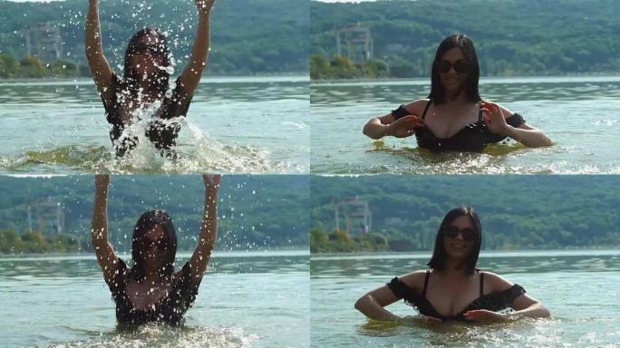 慢动作: 穿着黑色复古泳衣和太阳镜的女人在河里玩水。十几岁的女孩在夏天的海滩上游泳和飞溅。享受大自然