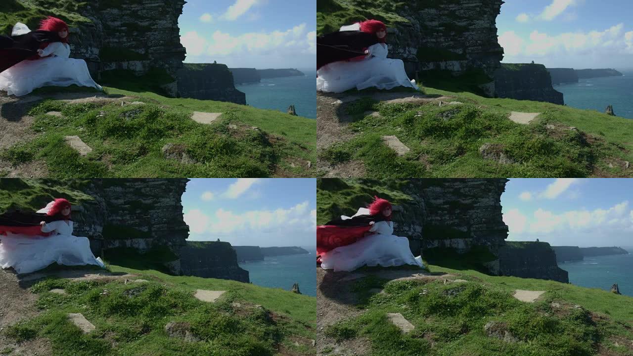 爱尔兰Moher景观悬崖上红发公主的4k镜头