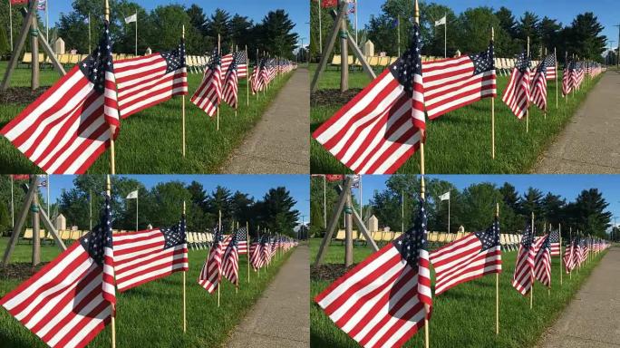 在美丽温暖的夏日午后，一排排美国国旗在退伍军人纪念碑附近