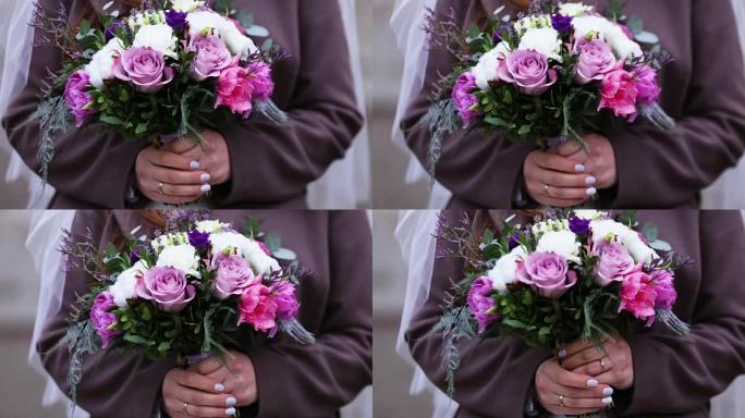 新娘手中的彩色婚礼花束
