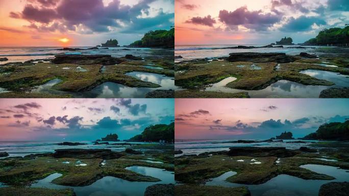 日落在破碎的海滩上时光倒流。在远处可以看到印度尼西亚巴厘岛上的Tanah Lot神庙。