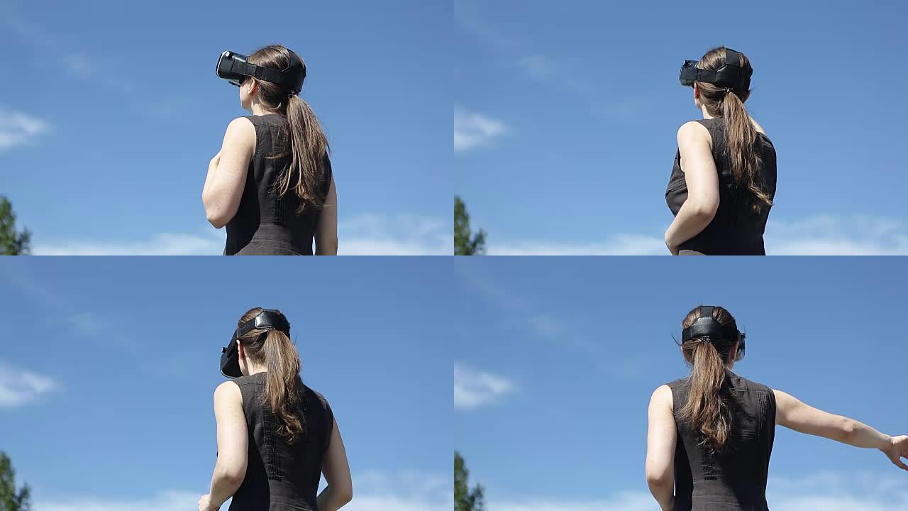 女人在天空的背面使用虚拟现实眼镜
