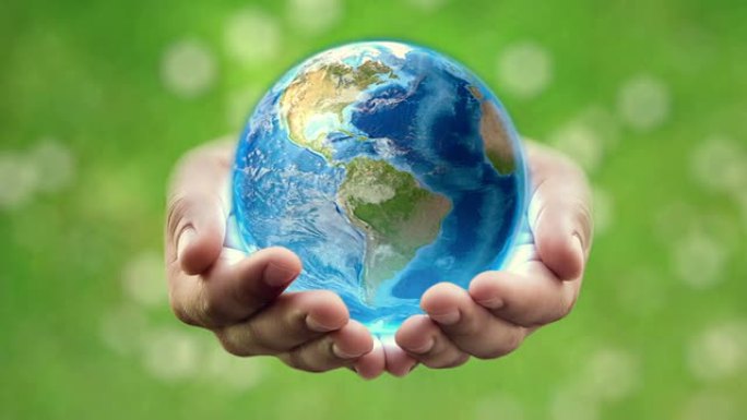 人类手中的地球-绿色背景