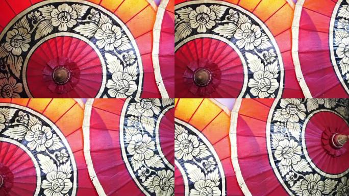 传统手工制作亚洲红伞东方风格的特写镜头。亚洲旅行摘要背景