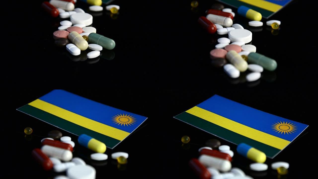 卢旺达国旗，黑色背景上隔离了许多医用药丸