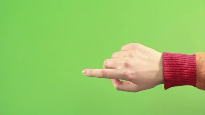 绿色背景上孤立的右手做手势。绿屏工作室