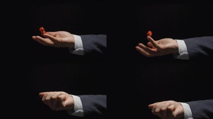 慢镜头:商人一手举起几个红色方块(近景，侧景)