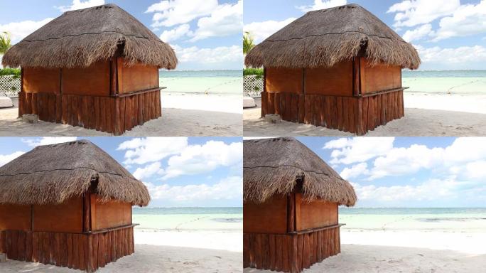 加勒比海有棕榈叶屋顶的热带木屋