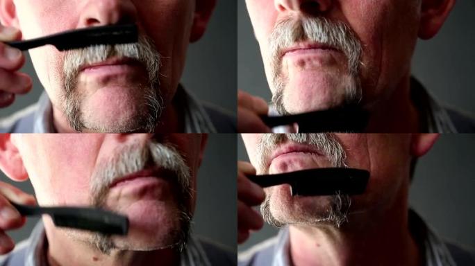 50多岁的男人梳理胡须的特写镜头