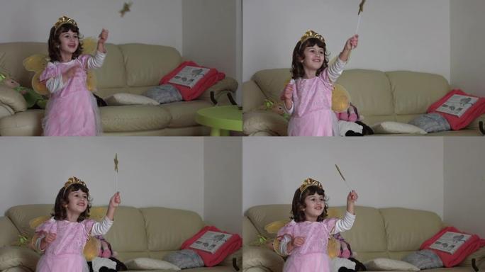 千禧一代的孩子打扮得像一个粉红色的仙女，带着小翅膀，魔杖和皇冠，铸造了一个真正的咒语