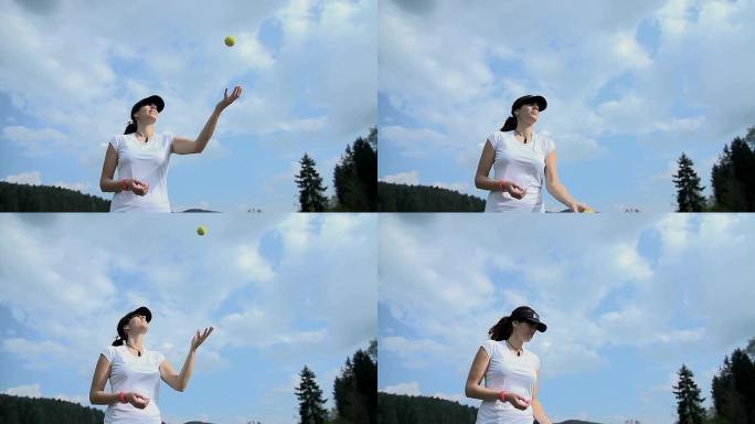 有吸引力的网球运动员在慢动作中与黄色球比赛