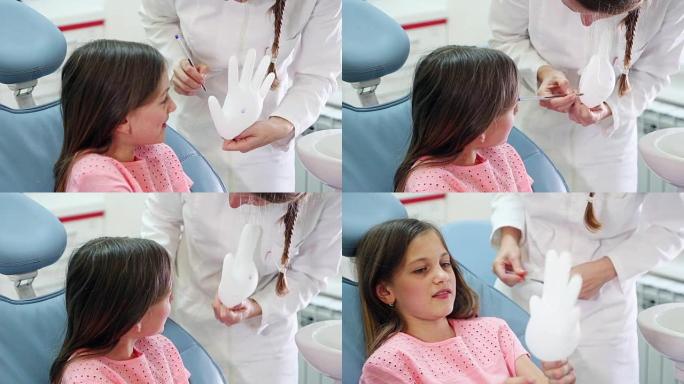 美女和牙医玩橡胶手套的特写