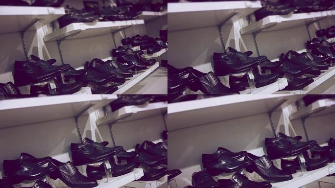 商店货架上的男士靴子和鞋子