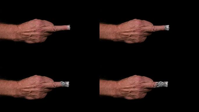 手指像香烟一样燃烧的人的手，慢动作4K