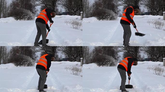 冬天在snovy路上用铲雪的人