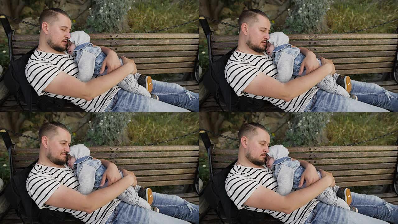 爸爸和小儿子在公园的长凳上休息