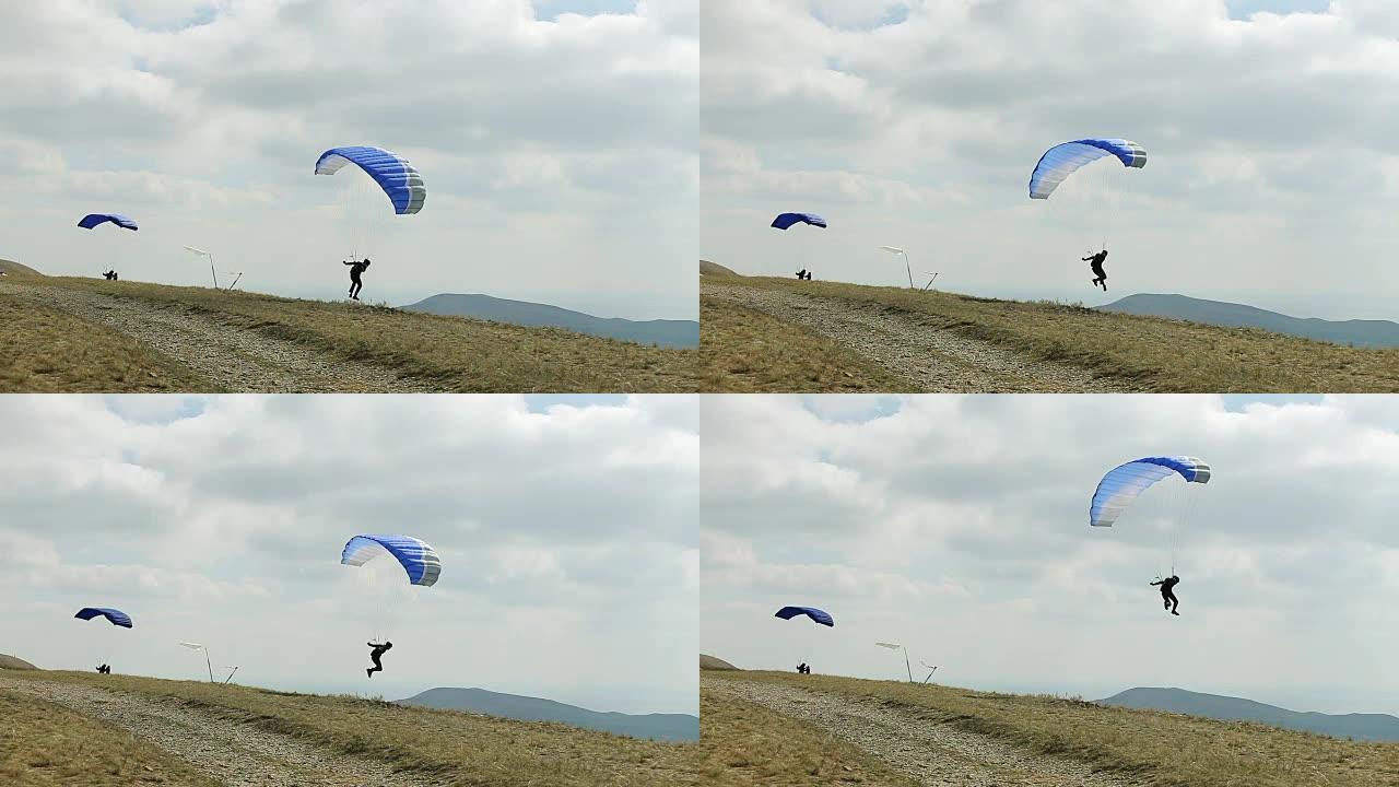 风把滑翔伞吹到天空