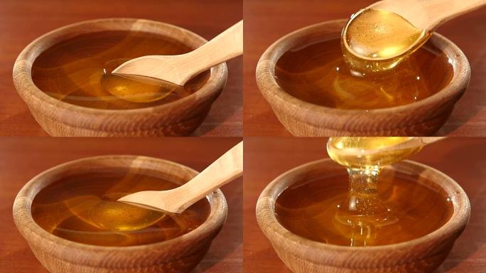 在木碗中用勺子取蜂蜜，慢动作