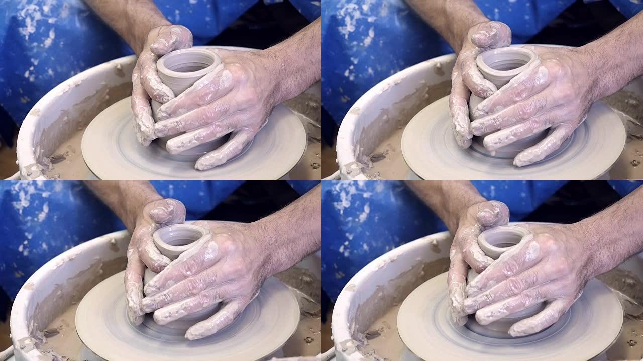 陶器大师在陶工的轮子上制造花瓶
