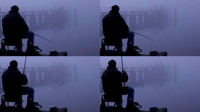 坐在桥上钓鱼的人的剪影