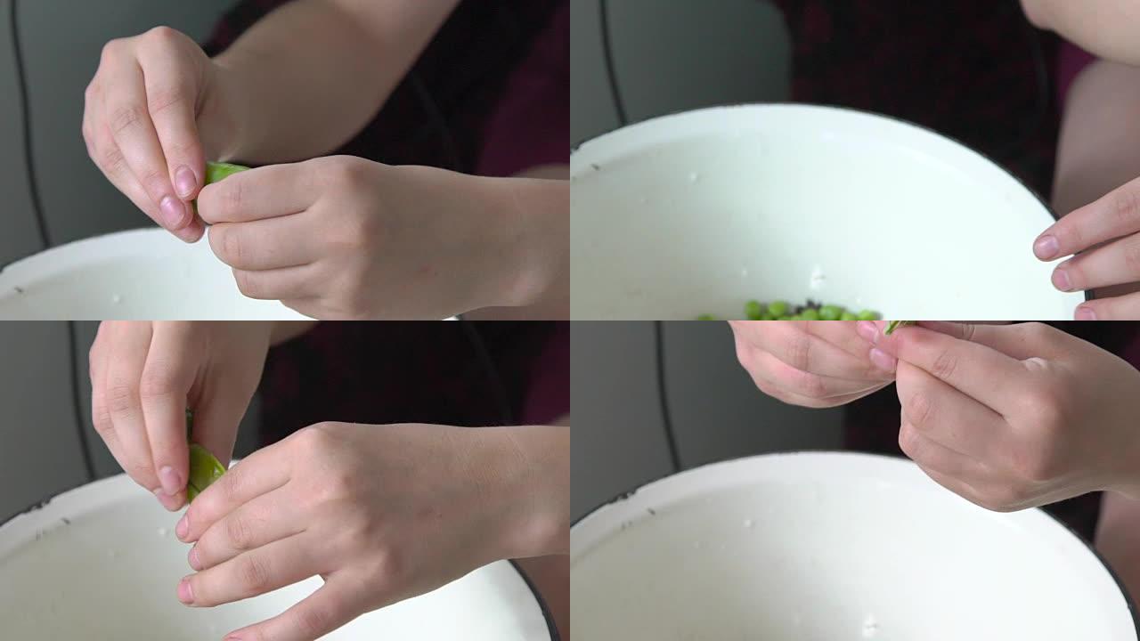 年轻的手在碗里剥绿豌豆