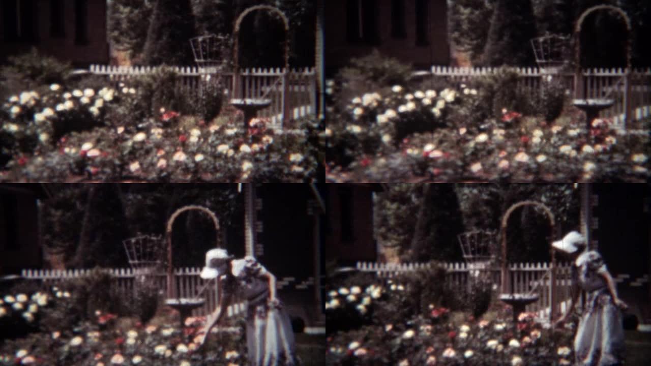 1939年:戴着白色帽子在前院种玫瑰花的妇女。