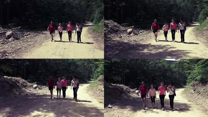 家庭在森林乡村公路上徒步旅行，4k steadicam徒步旅行拍摄