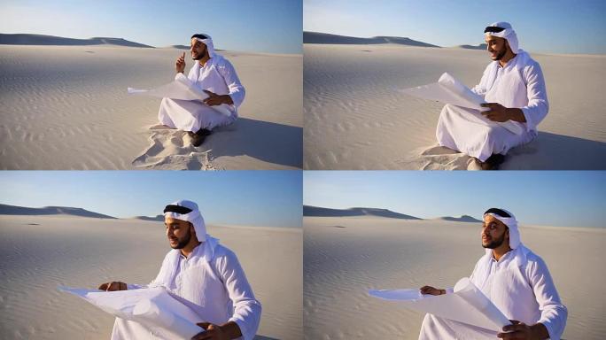 有事业心的男性谢赫商人坐在手里的白纸和思考新项目的想法在沙漠炎热的一天